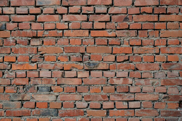 The texture of a brick wall. Texture of dark red brick, brick wall.
