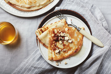 French crepes with honey and hazelnuts.