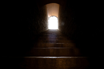 Stairs to the light. End of the tunnel. Afterlife concept. To the heaven concept