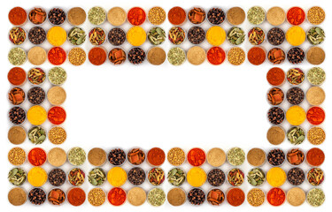 Set of spices in jars on a white background. Many diverse Indian spices, herbs, peppers. Flat lay.