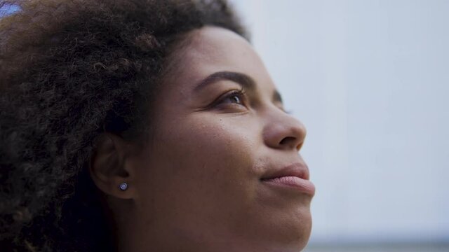 Afro-american business woman in eyeglasses looking seriously, gender equality