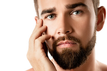 Obraz premium Young and handsome bearded man with smooth skin