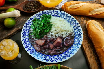 Traditional Brazilian feijoada with cabbage and rice