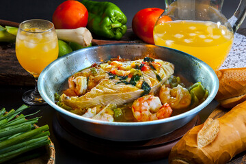 Moqueca, a traditional Brazilian dish with badejo fish and large shrimp, Badejo