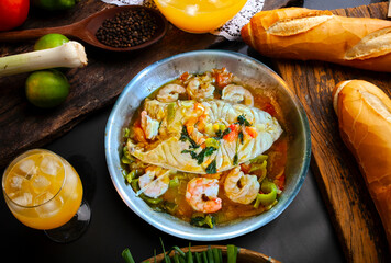 Moqueca, a traditional Brazilian dish with badejo fish and large shrimp, Badejo
