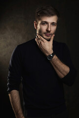 Young handsome man wearing a polo neck