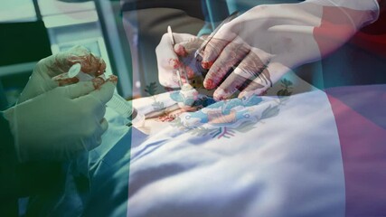 Animation of flag of mexico waving over surgeons in operating theatre - Powered by Adobe