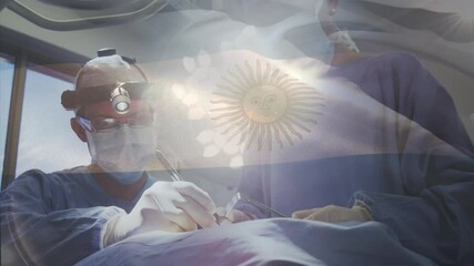 Animation of flag of argentina waving over surgeons in operating theatre - Powered by Adobe