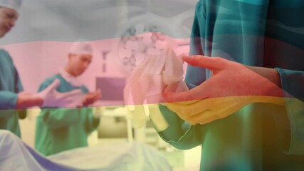 Animation of flag of germany waving over surgeons in operating theatre - Powered by Adobe