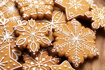 Tasty Christmas cookies on wooden plate, closeup