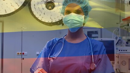 Animation of flag of colombia waving over anesthesiologist in operating theatre - Powered by Adobe