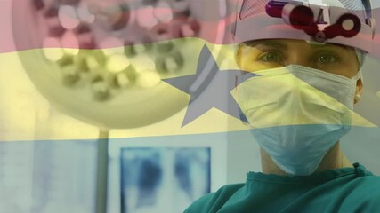 Animation of flag of ghana waving over surgeon in hospital - Powered by Adobe