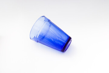 Empty blue water glass Isolated on white background.