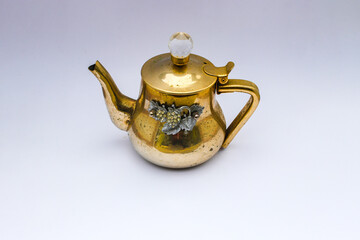 Antique teapot isolated on white background. Stock photo