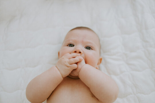 cute baby portrait at home on bed
