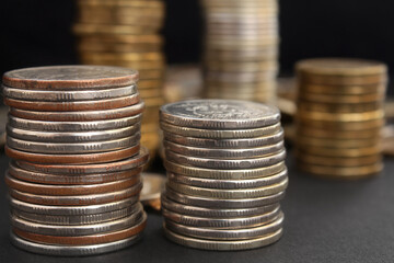 stacks of coins close up on black background