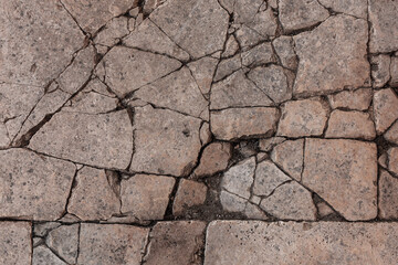 Old aged damaged marble bumpy uneven blocks. Trip pitted grunge granite tile cobble. Cragged grimy retro cranny frayed run track. Crannied dirtied shabby smashed gaping rustic big holes for 3d design