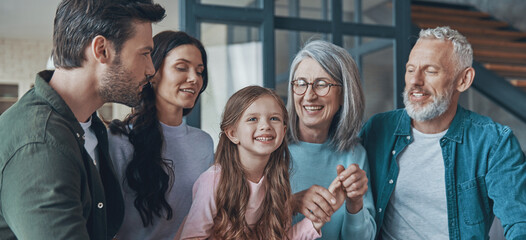 Happy family spending time together and smiling while sitting on