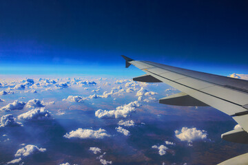 airplane wing and clouds