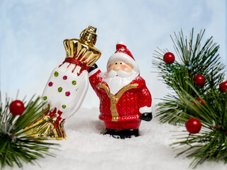 christmas tree toys santa claus with gifts on a blurry background
