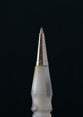 traditional closeup handicraft pen on black background 