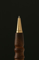traditional closeup handicraft pen on black background 