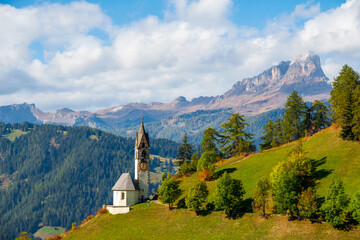 Church of Santa Barbara during the day in the cozy little village of La Valle, Alta Badia, South...