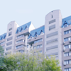 Facade of a multi-storey modern building. Typical city development.