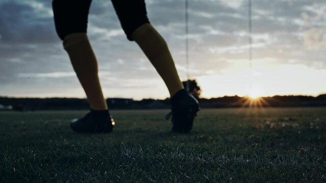 Cinematic American Football Kickoff Game Start. Static Close-up of Ball Being Kicked by the Professional Player. Gates Goal Kick. Successful Team Scores and Wins Championship. Stylish Slow Motion Shot