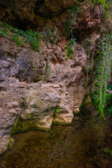ANTALYA, TURKEY: Rocks with caves in the nature park at the Upper Duden Waterfall in Antalya.