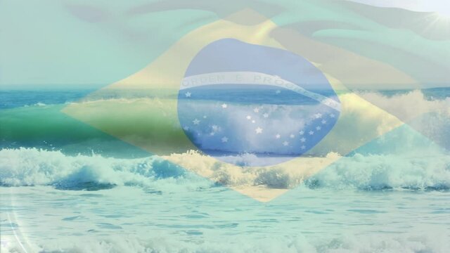 Digital composition of waving brazil flag against aerial view of waves in the sea