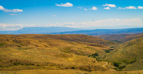 vista of Montana landscape with grassland hills and ravines 
