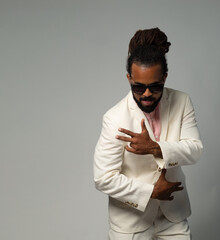 afro cuban with dreadlocks in suit