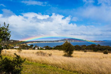 Rainbow over a bay in Tasmania