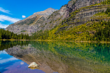 Fototapeta na wymiar Mountains Reflecting On The Clear Water of Avalanche Lake, Glacier National Park, Montana, USA