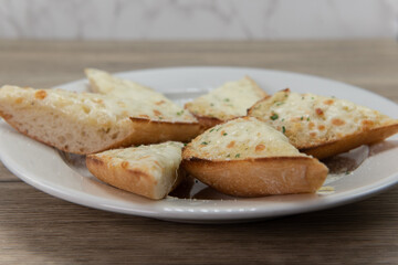 Perfect appetizer for a hearty Italian meal starts with cheesy garlic knots bread