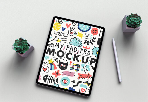 Tablet Mockup on a Sandpaper White Desk and Trendy Succulents Green Flowers