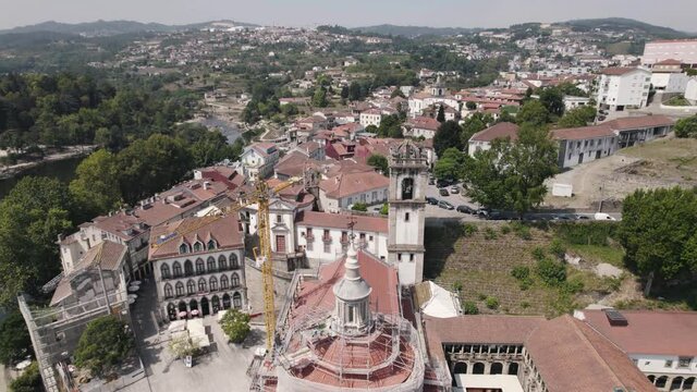 Aerial orbiting over Amarante historic town with S&atilde;o Gon&ccedil;alo church and Tamega River 