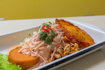 Peruvian eviction, accompanied by sweet potato, chili, corn cake.