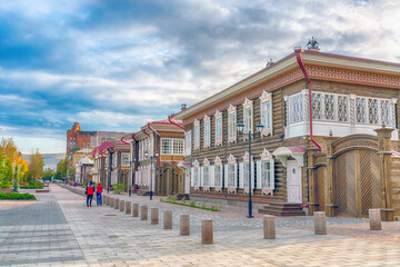 Pedestrian alley in Krasnoyarsk. Old wooden houses