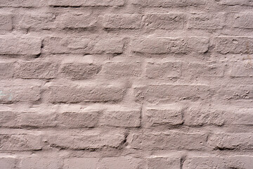 Clean, freshly painted, tan, generic, brick cinder block wall background.