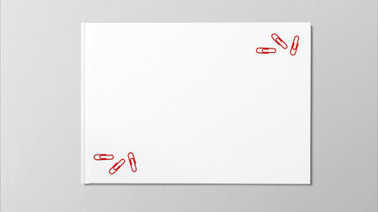 Red paper clips on white paper  decorated with copy space