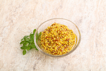 Grain mustard sauce in the bowl