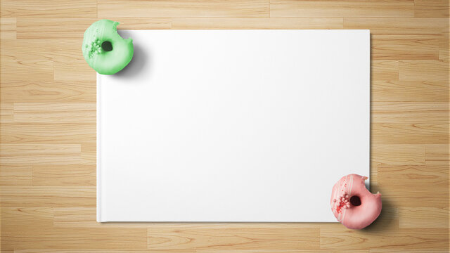 Doughnuts on white paper on wooden background with copy space free image