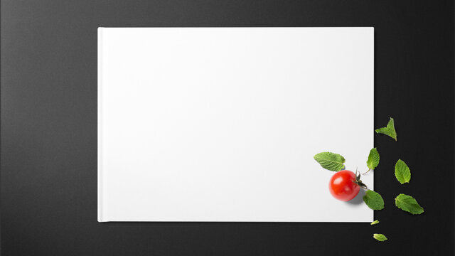 Mint with tomato on white paper on black background with copy space free image