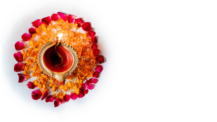 beautiful Diya in on flower bed for Diwali and Deepawali