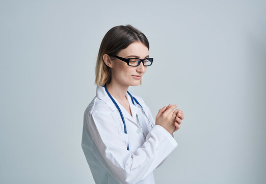 female doctor in white coat autoscope hospital professional