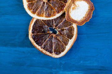 dried oranges on a dark blue slate, stone or concrete background.Christmas background, celebration, New Year's party concept. Beautiful jewelry. ingredients for making mulled wine. top view