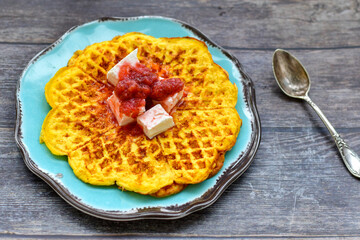 Bakery. Home made ketogenic   waffle pancakes with   organic  bio eggs and home made  strawberry jam  on wooden background. Rustic style breakfast