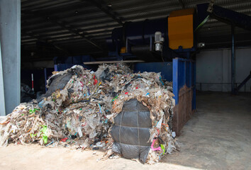 The waste disposal plant compresses the waste to be transported for recycling.